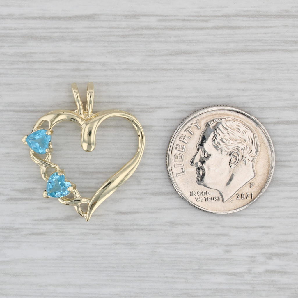 Gray 0.60ctw Blue Topaz Hearts Open Heart Pendant 10k Yellow Gold