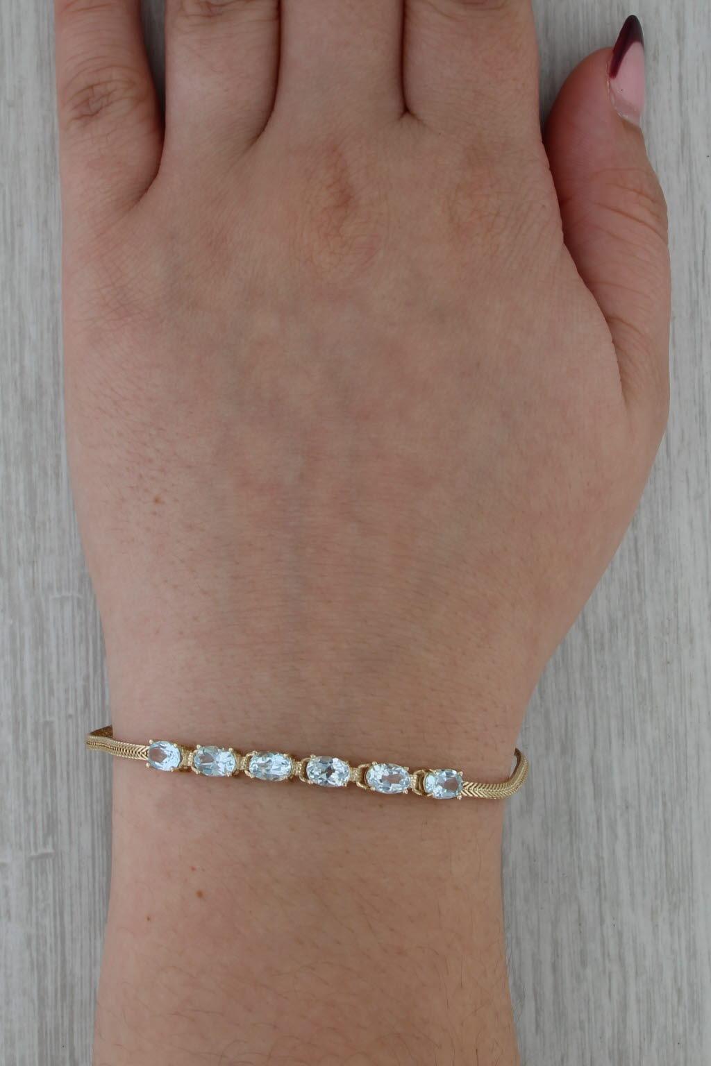 3.10ctw Blue Topaz Bracelet 14k Yellow Gold 6.5" Herringbone Chain