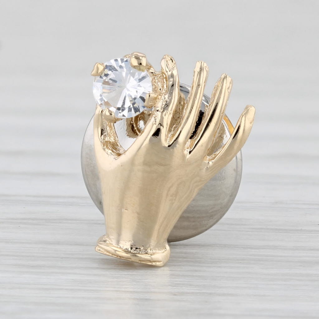 Light Gray Hand Holding 0.20ct Cubic Zirconia Pin 14k Yellow Gold Lapel