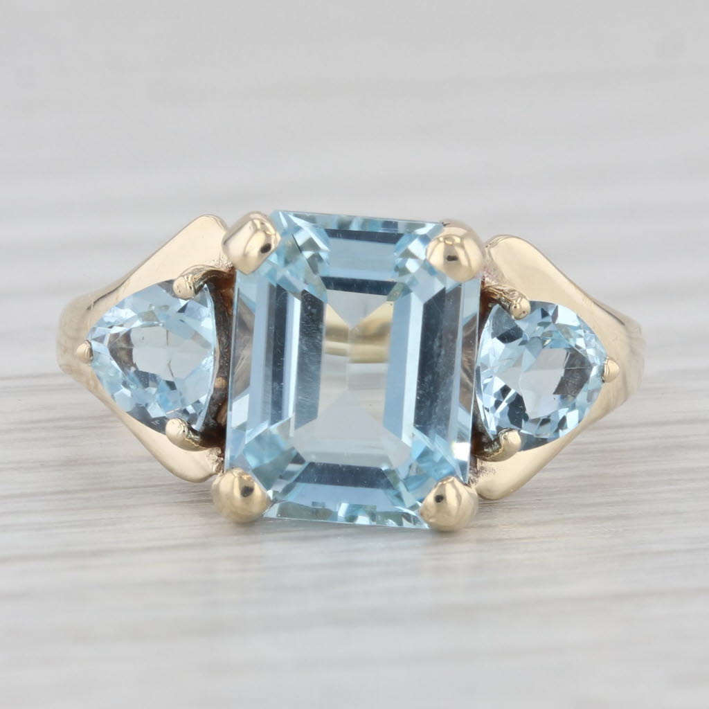 Light Gray 5.50ctw Emerald Cut Blue Topaz Ring 10k Yellow Gold Size 7