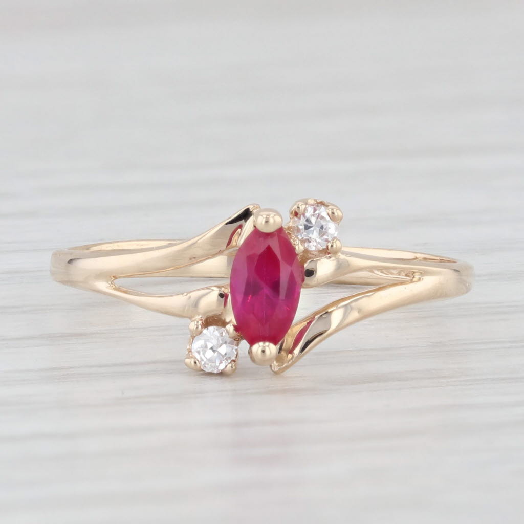 Light Gray 0.39ctw Lab Created Ruby Cubic Zirconia Ring 10k Yellow Gold Size 7 Bypass