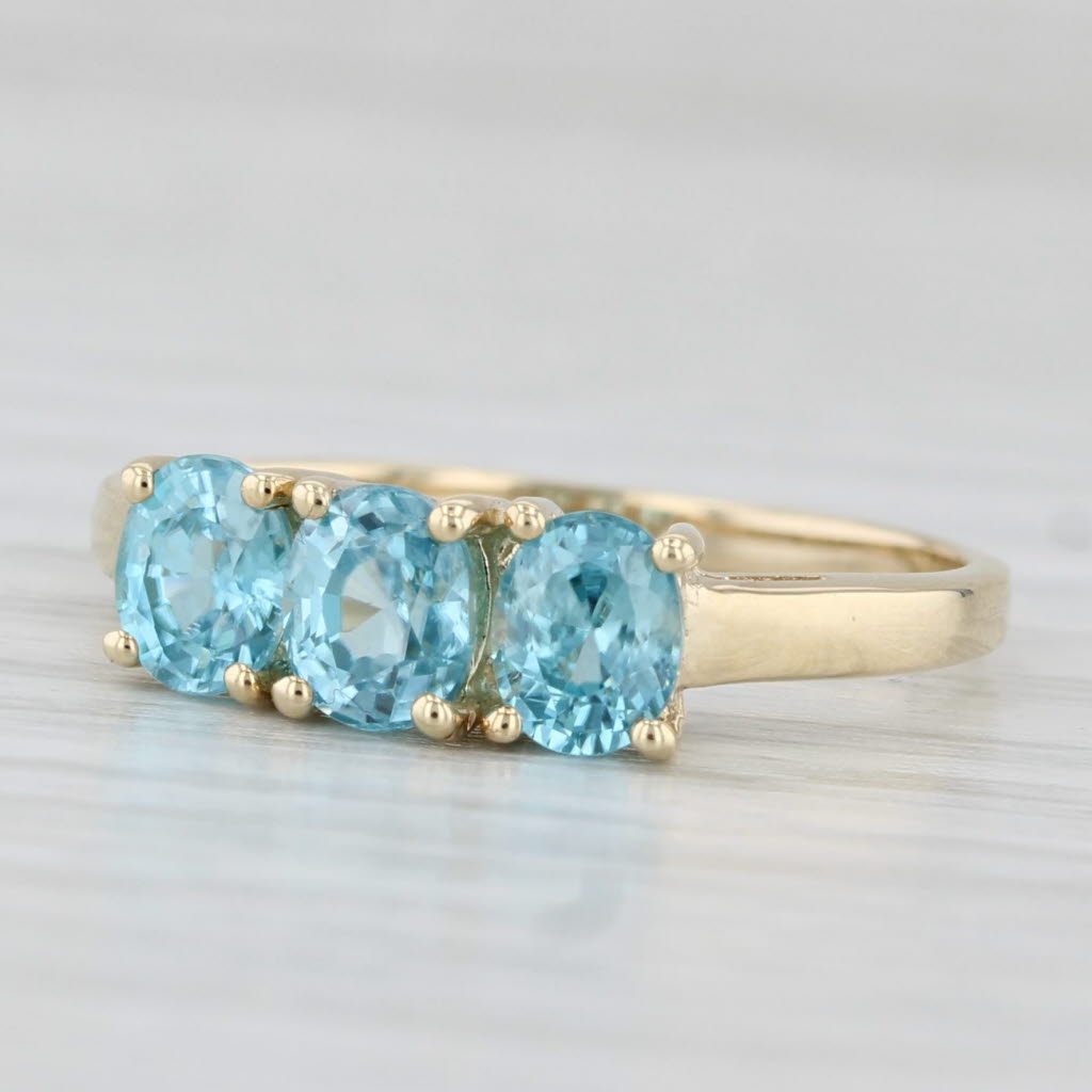 Light Gray 0.90ctw Oval 3-Stone Blue Zircon Ring 10k Yellow Gold Size 7