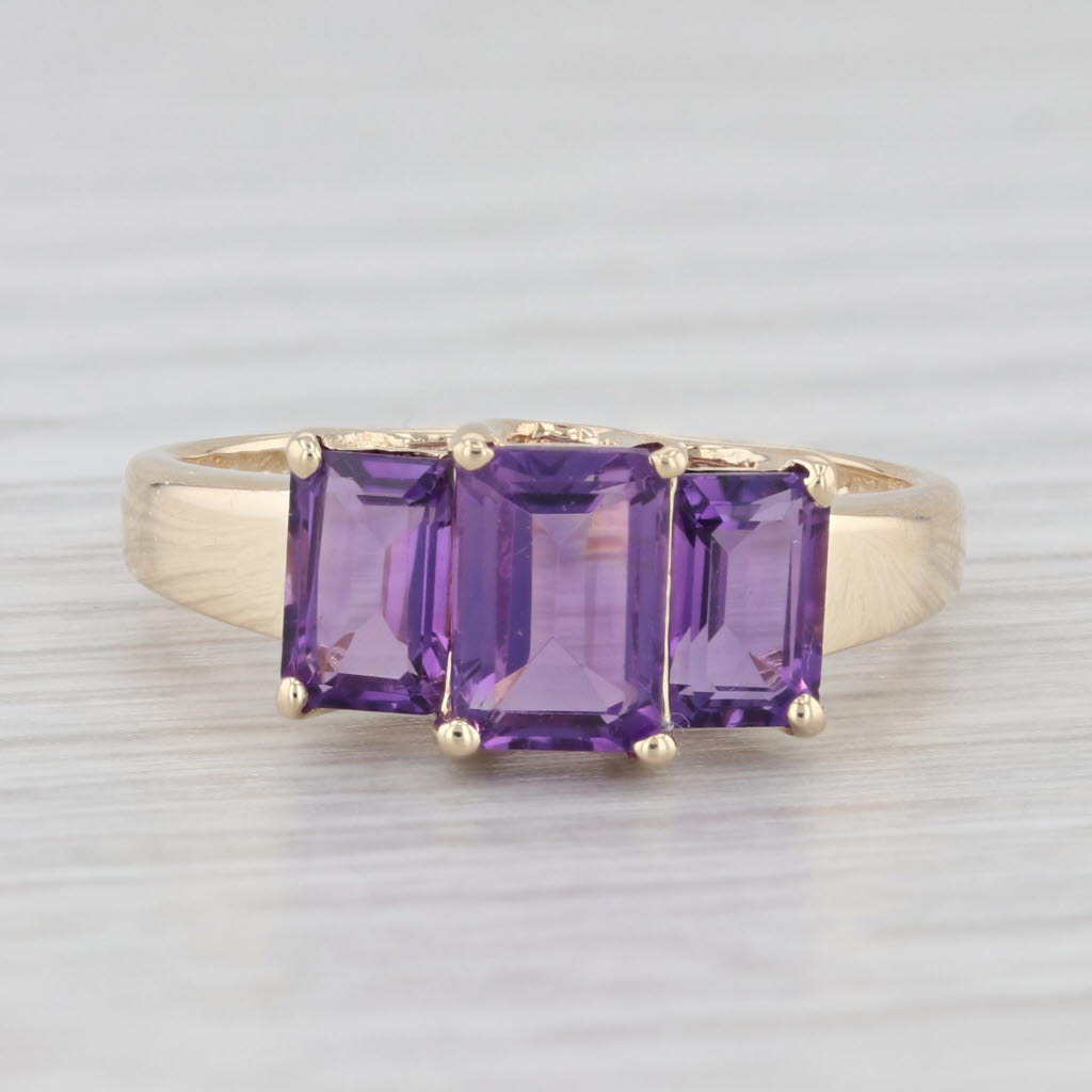 Light Gray 1.88ctw 3-Stone Emerald Cut Amethyst Ring 10k Yellow Gold Size 7.5