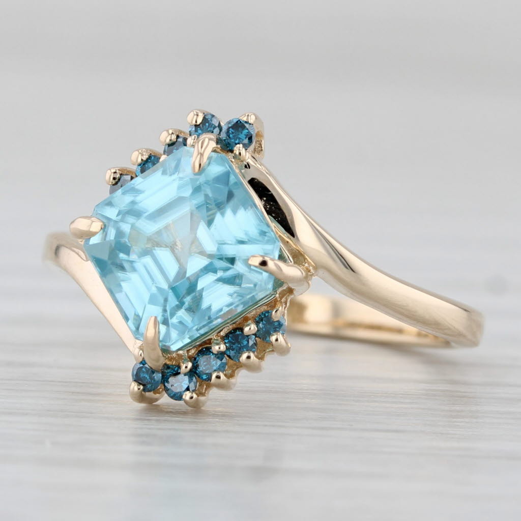 Light Gray 2.58ctw Blue Zircon Blue Diamond Bypass Ring 10k Yellow Gold Size 5