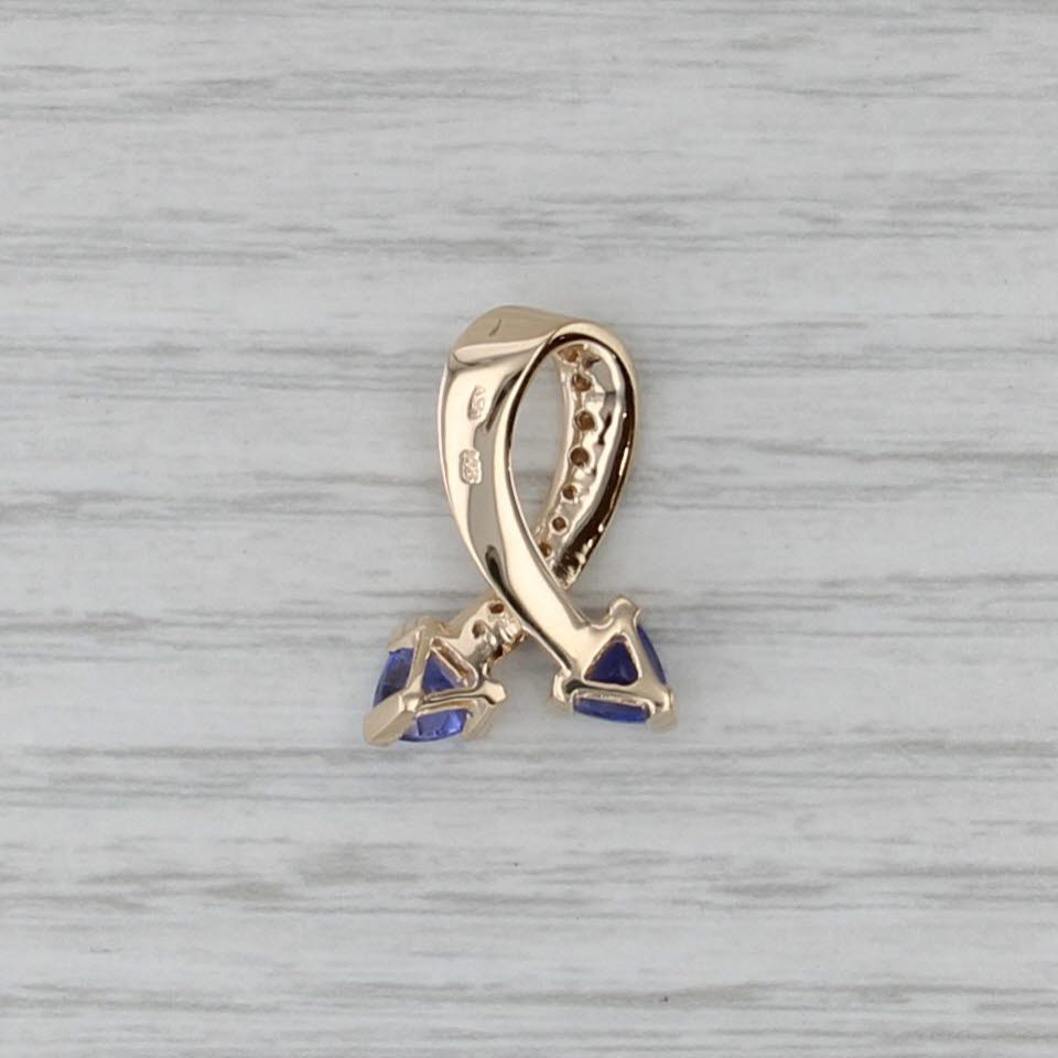 0.88ctw Tanzanite Diamond Support Ribbon Pendant 14k Yellow Gold