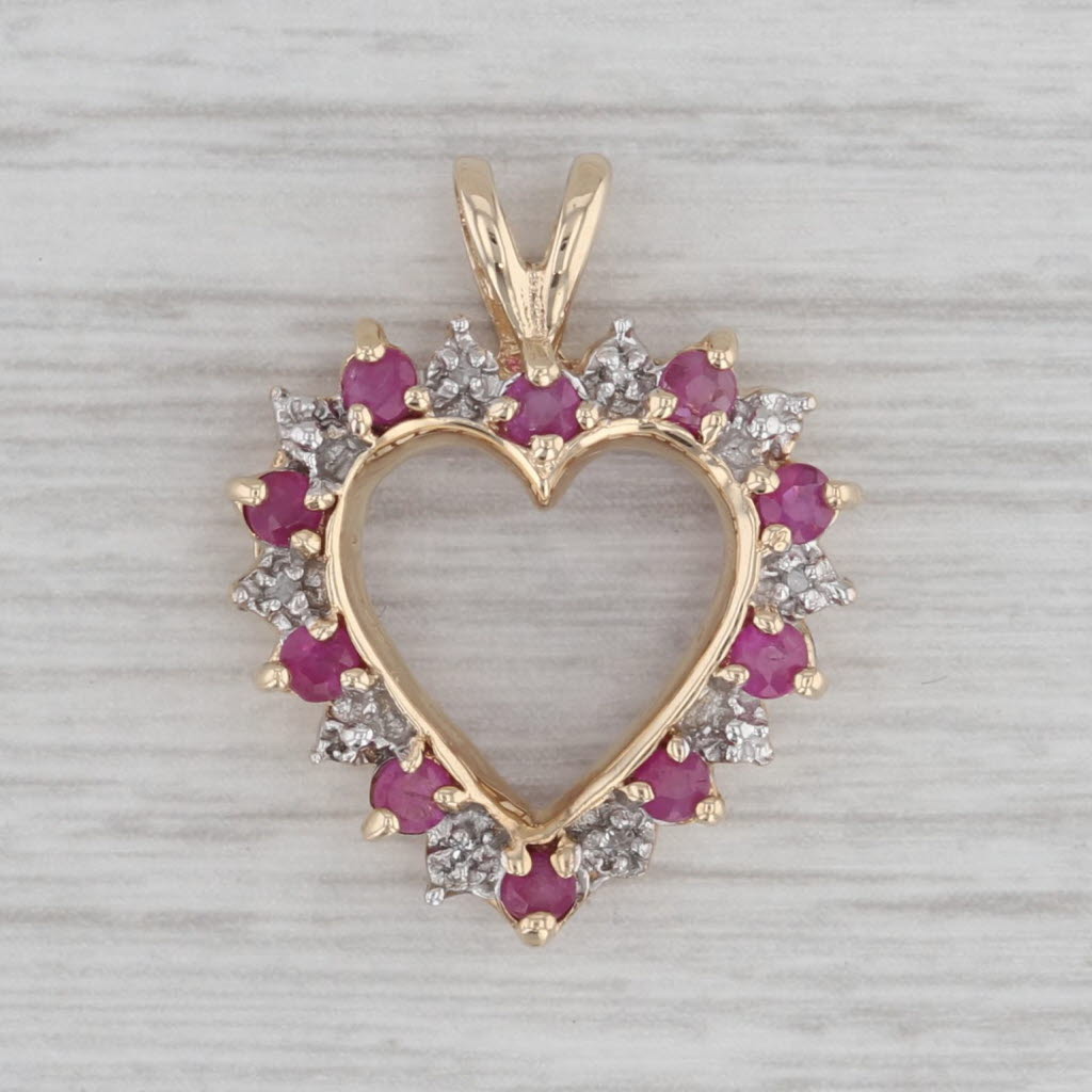 Gray 0.64ctw Diamond Ruby Open Heart Pendant 10k Yellow Gold