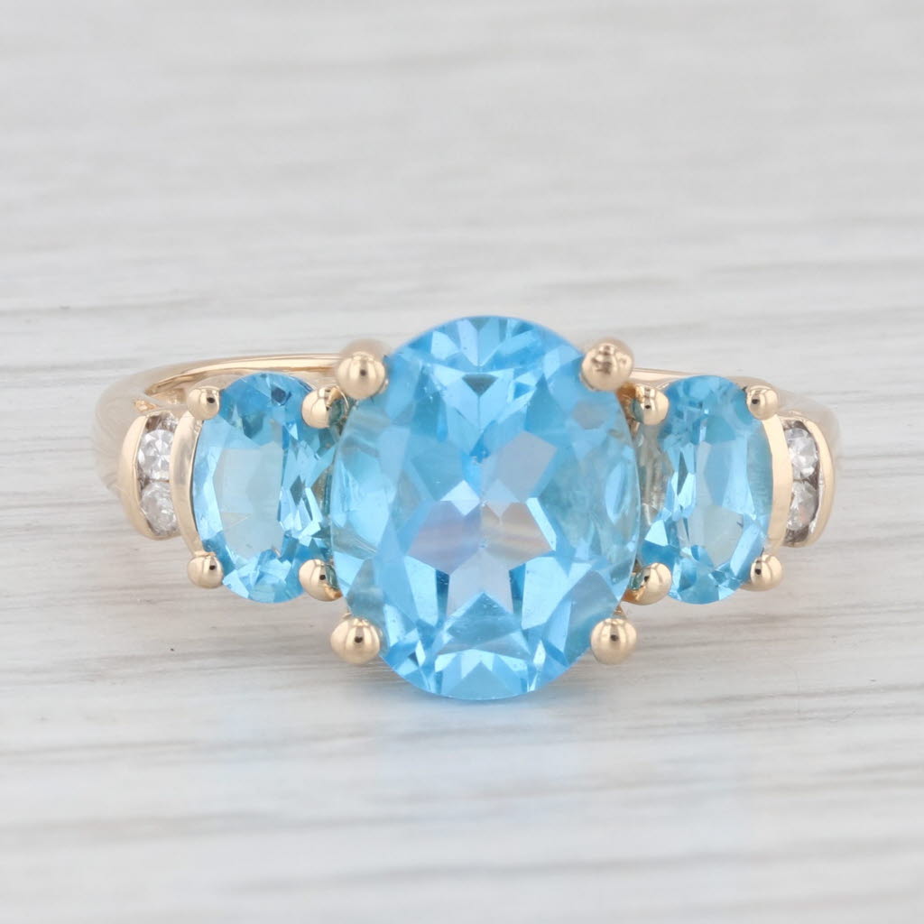 Light Gray 4.48ctw Oval Blue Topaz Ring 14k Yellow Gold Diamond Accents Size 7