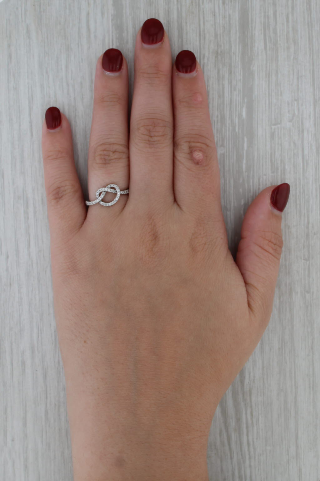0.25ctw Diamond Preztle Knot Ring 10k White Gold Size 7.5