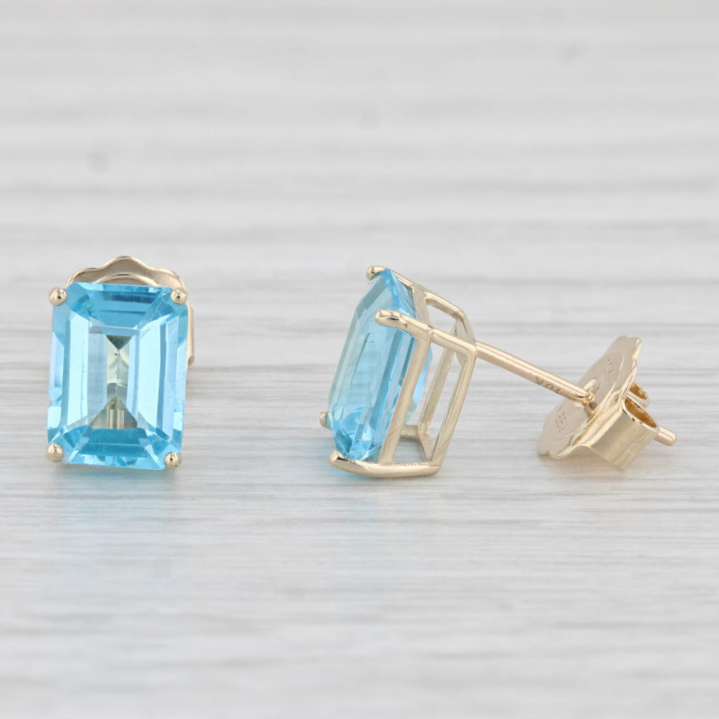 Light Gray 4ctw Blue Topaz Stud Earrings 10k Yellow Gold Emerald Cut Solitaires