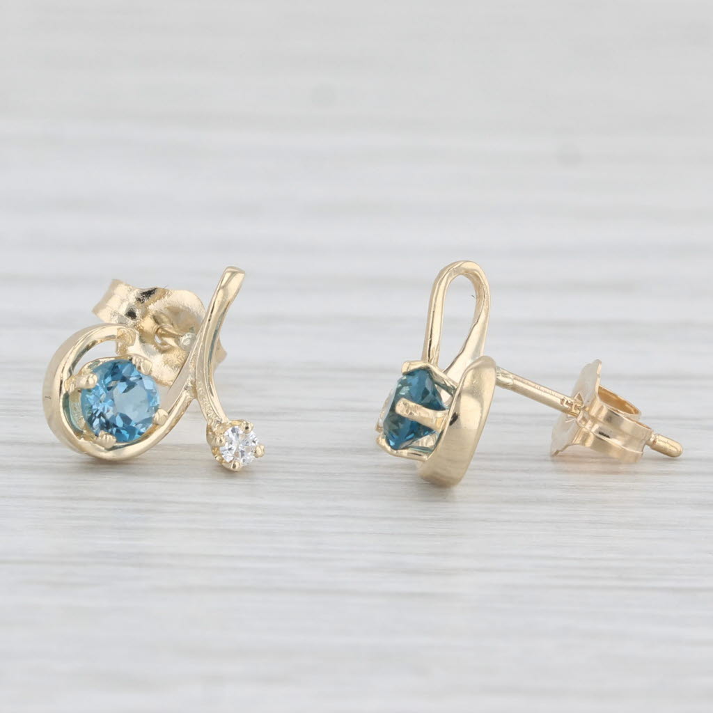 Light Gray 0.48ctw Blue Topaz Diamond Swirl Stud Earrings 14k Yellow Gold