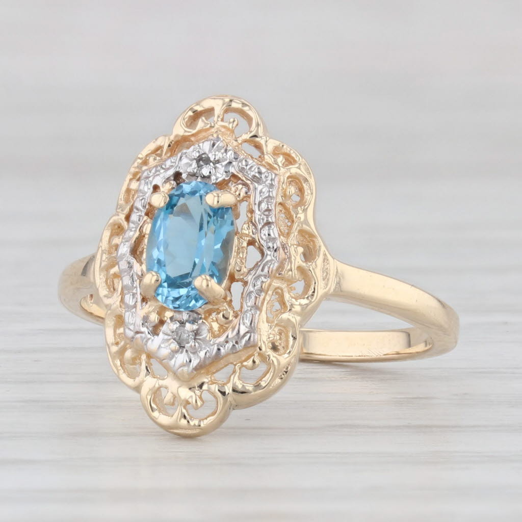 Light Gray 0.60ct Oval Blue Topaz Ring 10k Yellow Gold Size 6 Diamond Accents