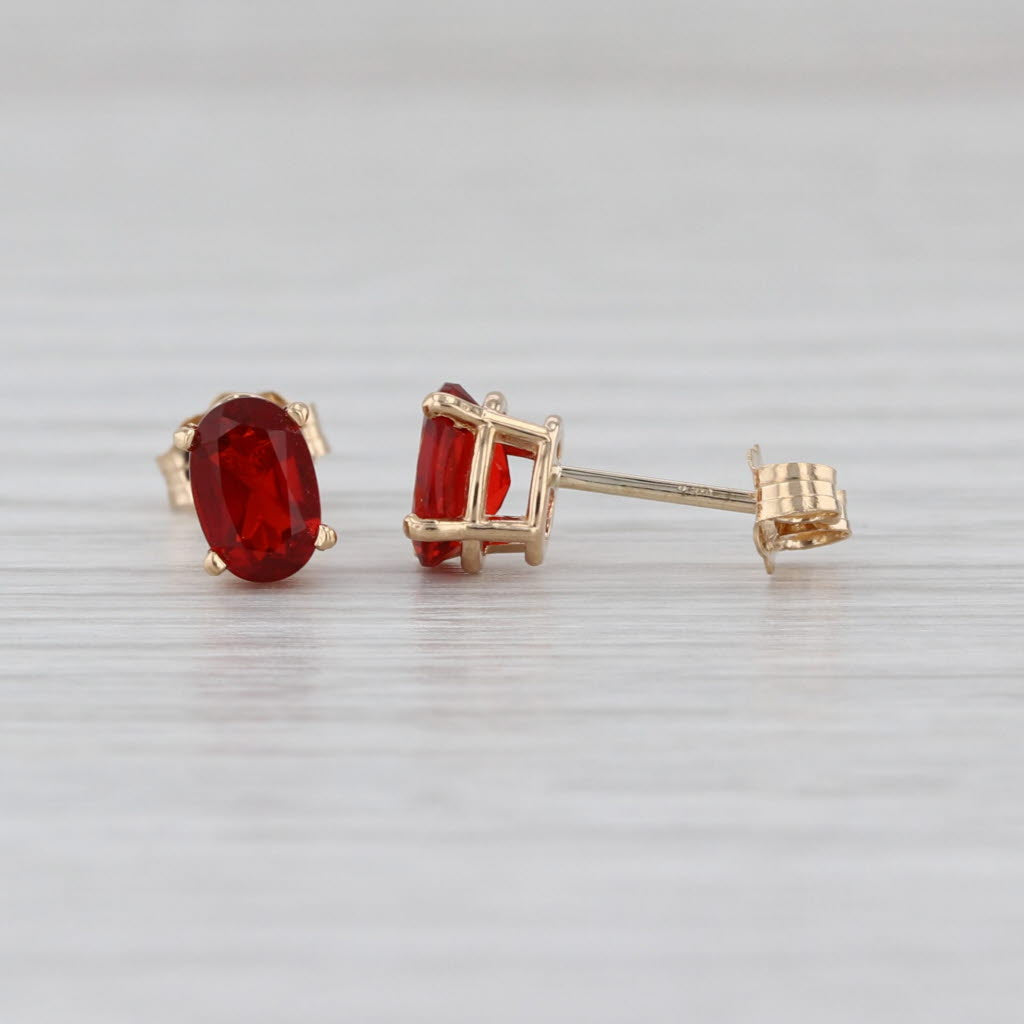 0.56ctw Fire Opal Stud Earrings 14k Yellow Gold Oval Solitaire Studs