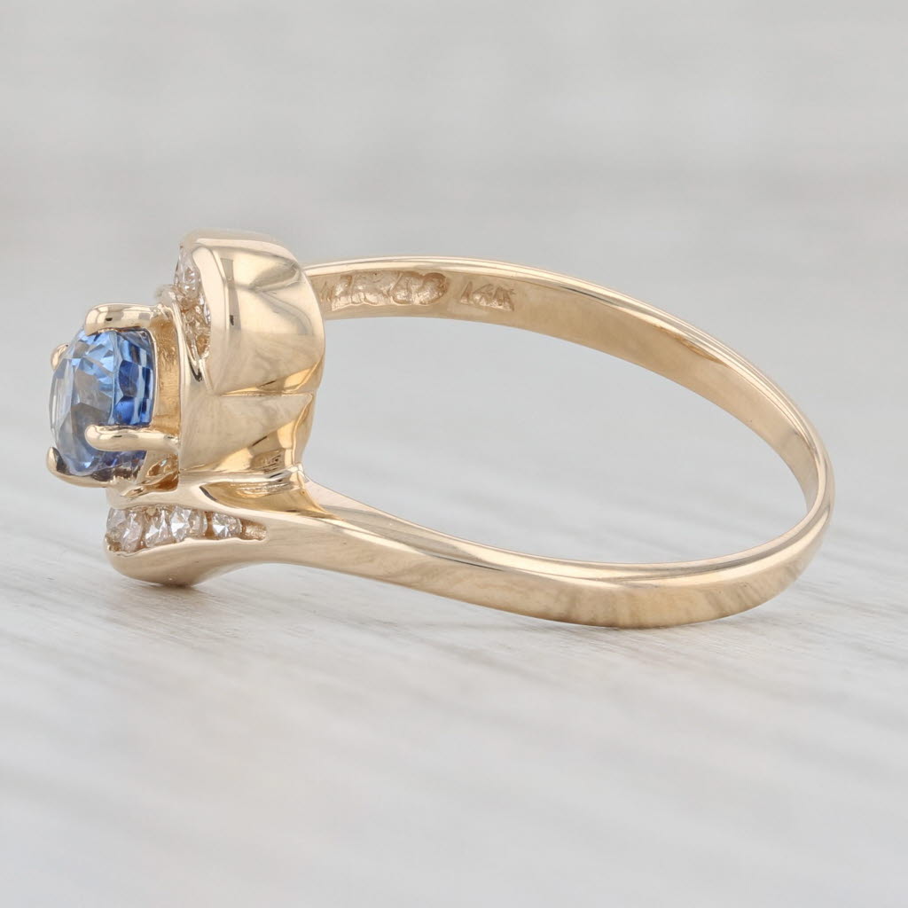 Light Gray 1.43ctw Light Blue Oval Sapphire Diamond Bypass Ring 14k Yellow Gold Size 7.25