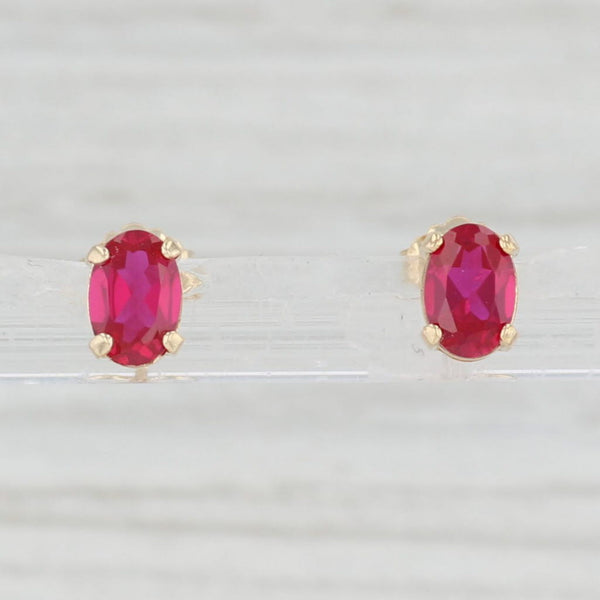 Light Gray 1.10ctw Lab Created Ruby Stud Earrings 14k Yellow Gold July Birthstone