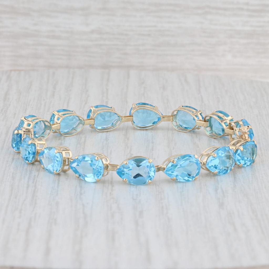 Light Gray 35ctw Blue Topaz Tennis Bracelet 14k Yellow Gold 7" 7mm