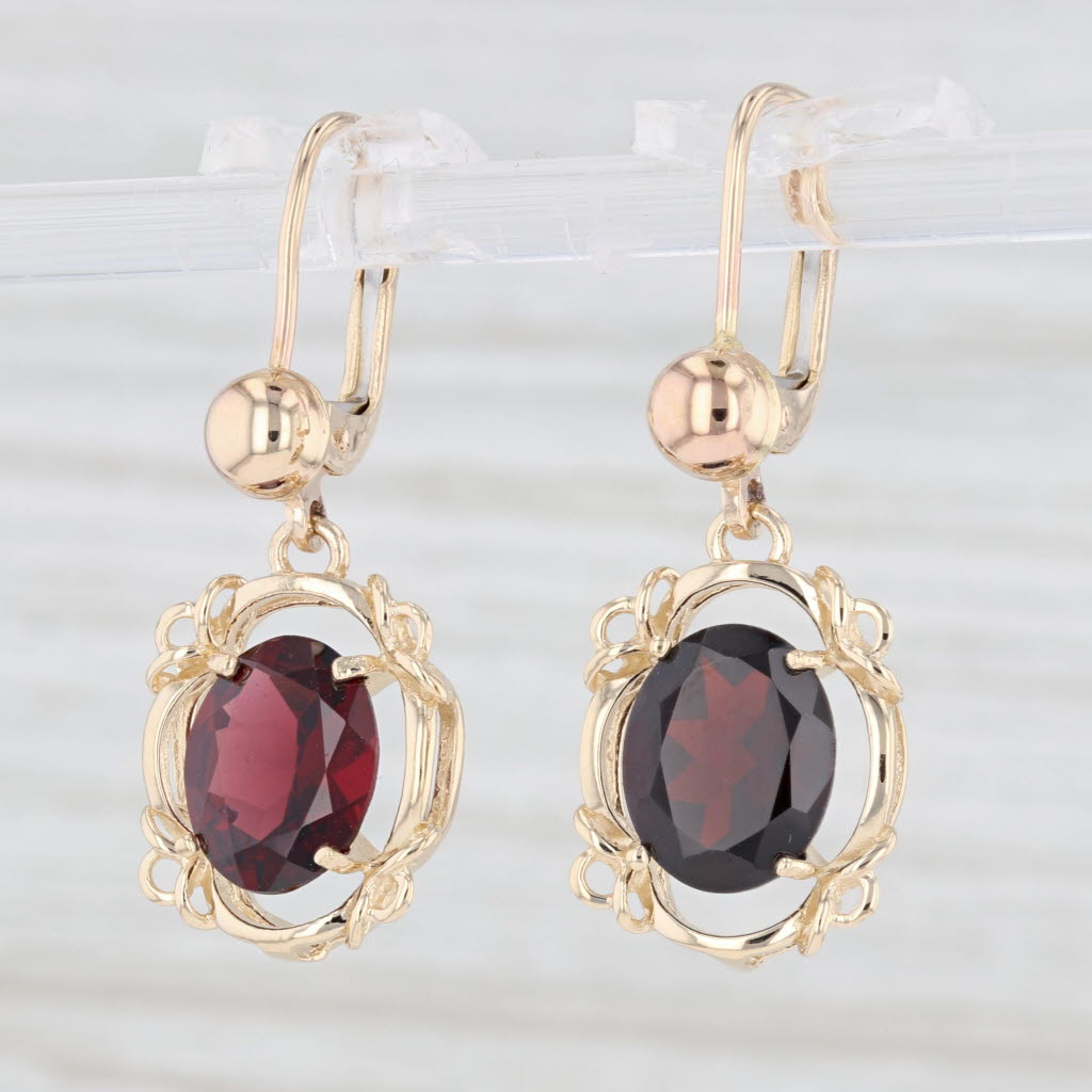 Light Gray 5.30ctw Garnet Oval Dangle Earrings 14k Yellow Gold January Birthstone