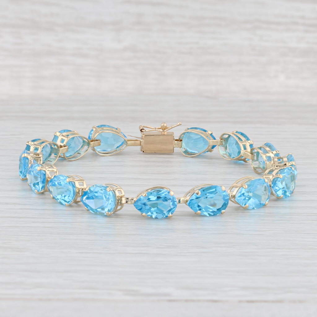 Light Gray 35ctw Blue Topaz Tennis Bracelet 14k Yellow Gold 7" 7mm