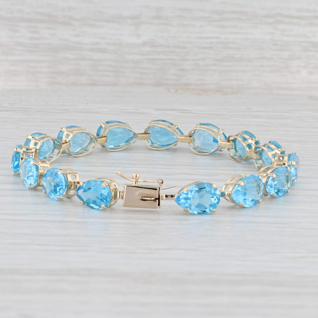 Light Gray 35ctw Blue Topaz Tennis Bracelet 14k Yellow Gold 7" 7mm