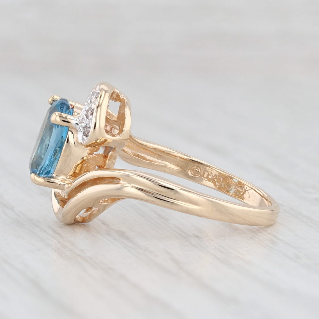 Light Gray 1.51ctw Oval Blue Topaz Diamond Bypass Ring 14k Yellow Gold Size 4.5