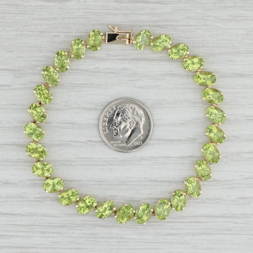 Light Gray 22.40ctw Peridot Tennis Bracelet 14k Yellow Gold 7.25" 7.3mm