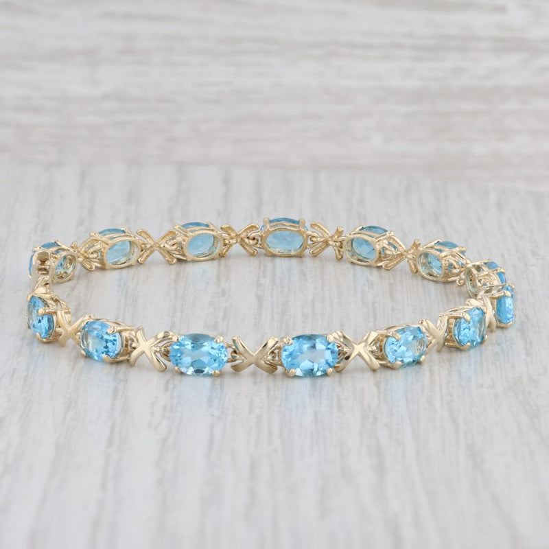 Light Gray 11.20ctw Oval Blue Topaz Tennis Bracelet 14k Yellow Gold 8" 5.2mm