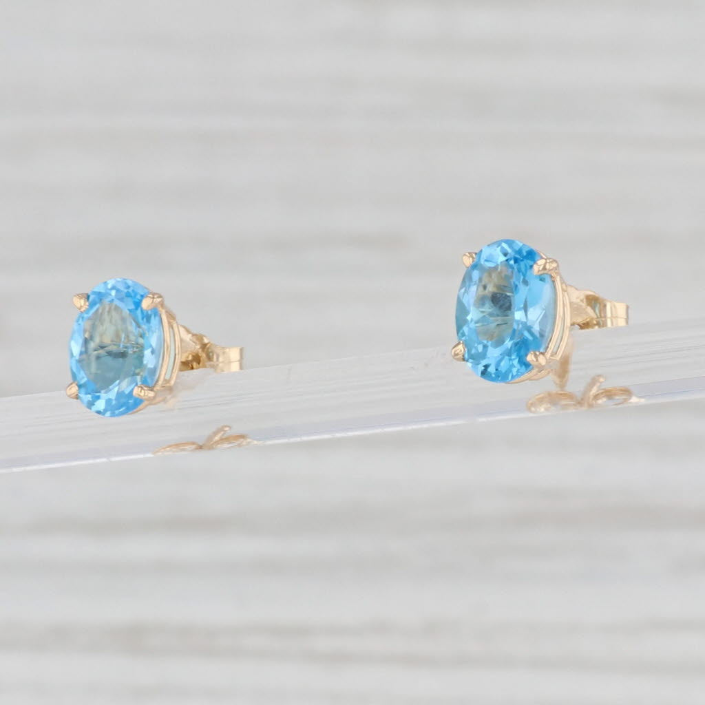 Light Gray 2.10ctw Oval Blue Topaz Solitaire Stud Earrings 14k Yellow Gold Pierced Studs