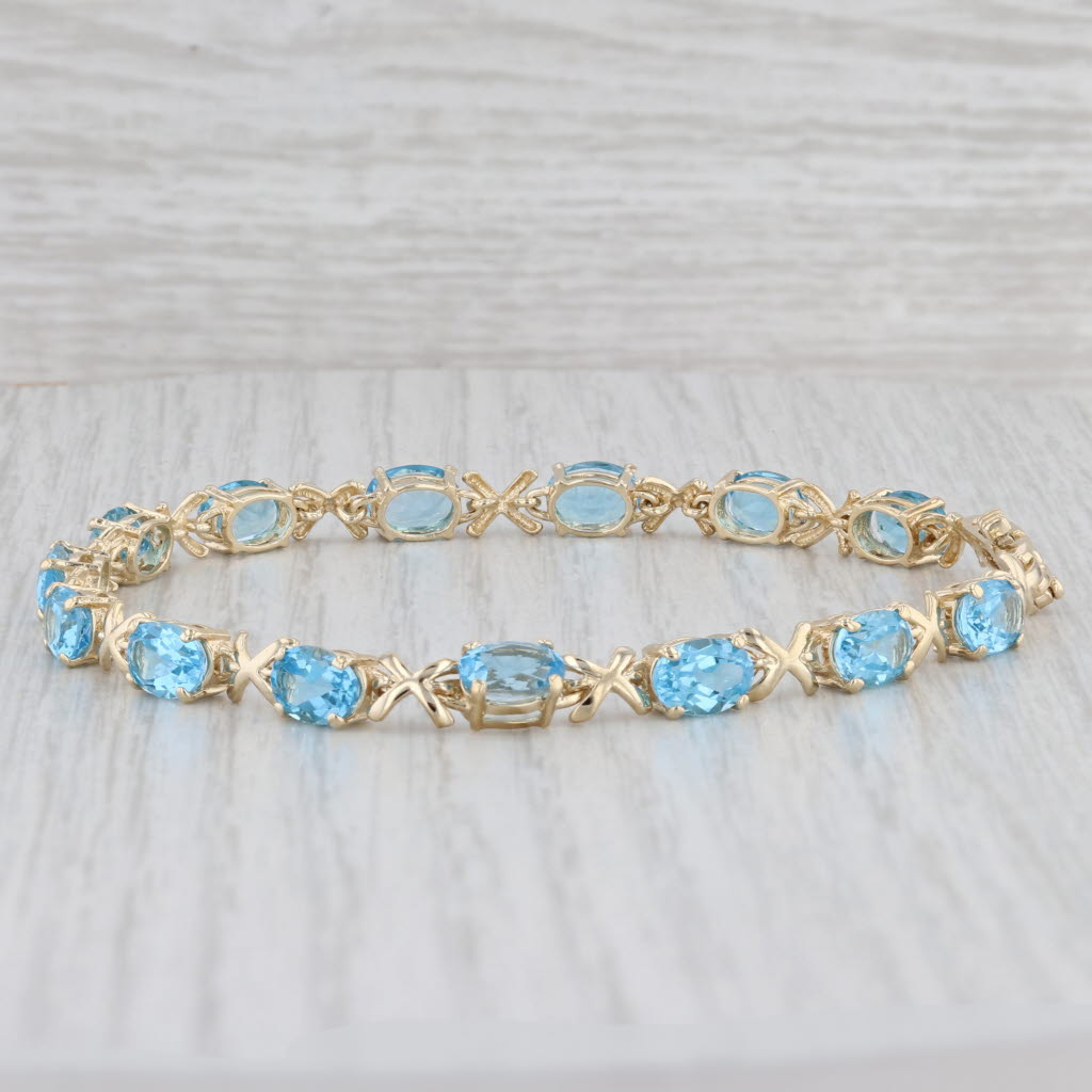 Light Gray 11.20ctw Oval Blue Topaz Tennis Bracelet 14k Yellow Gold 8" 5.2mm