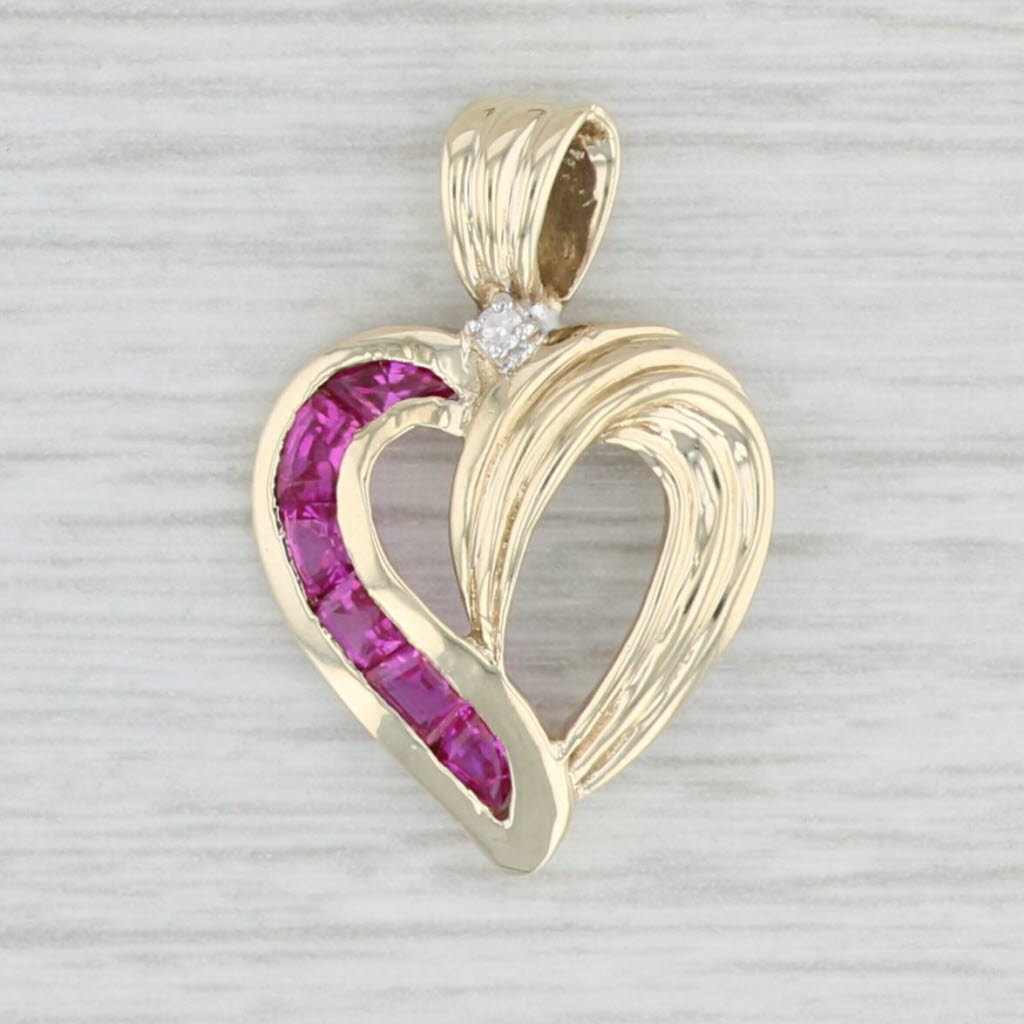 Light Gray 0.68ctw Lab Created Ruby Diamond Heart pendant 10k Yellow Gold