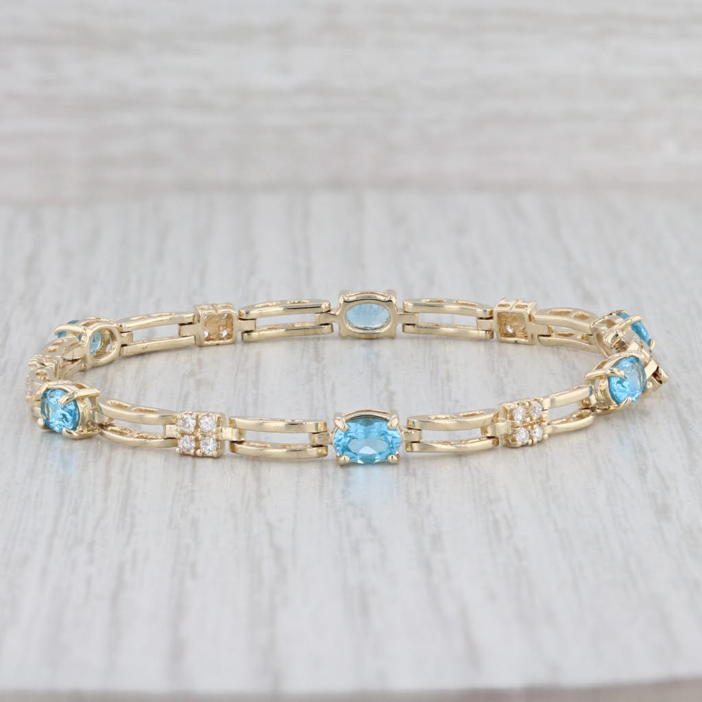 Light Gray 3.82ctw Oval Blue Topaz Diamond Tennis Bracelet 14k Yellow Gold 6.75" 4.5mm