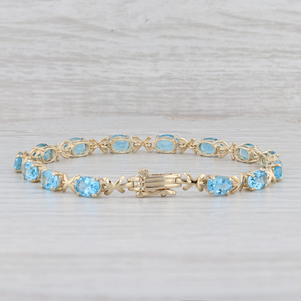 Light Gray 11.20ctw Oval Blue Topaz Tennis Bracelet 14k Yellow Gold 8" 5.2mm