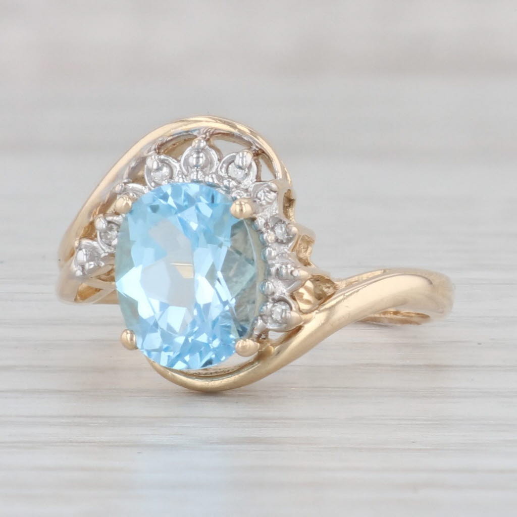 Light Gray 2.38ctw Blue Topaz Diamond Bypass Ring 14k Yellow Gold Size 6.75