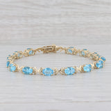 Light Gray 11.20ctw Oval Blue Topaz Tennis Bracelet 14k Yellow Gold 8" 5.2mm