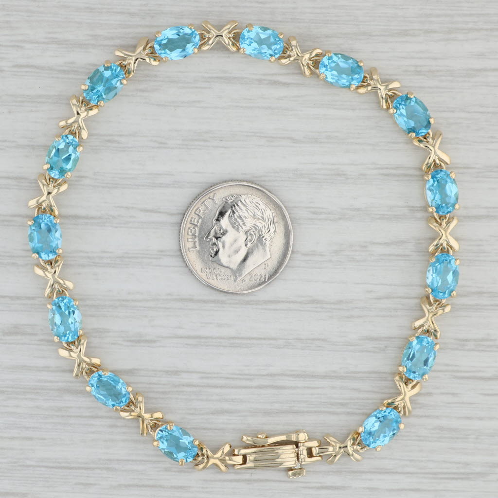 Gray 11.20ctw Oval Blue Topaz Tennis Bracelet 14k Yellow Gold 8" 5.2mm