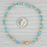 Gray 11.20ctw Oval Blue Topaz Tennis Bracelet 14k Yellow Gold 8" 5.2mm